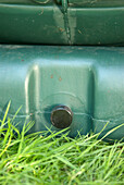 Green plastic compost tumbler bin