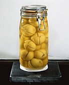 Glass jar containing lemon segments