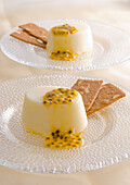 Two passion-fruit blancmanges with wafers