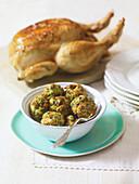 Bowl of stuffing balls and roast chicken