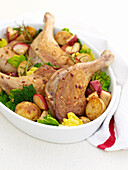 Roast duck with apple and rosemary potatoes