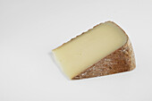 Slice of French Tomme de Brebis du Bearn cheese