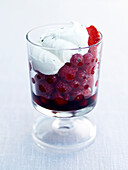 Boozy berries with mint and elderflower cream