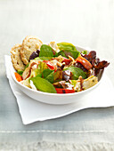 Artichoke and red bell pepper salad served in bowl