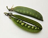 Smooth green snow pea pods