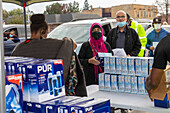 Water filter being distributed to residents, Michigan, USA