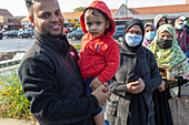 People lining up to receive water filters, Michigan, USA