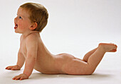 Naked baby lying on his stomach