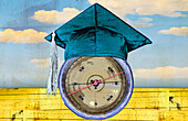 Mortar board on top of compass, illustration
