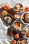 Summer peach crisp with oats in individual bowls