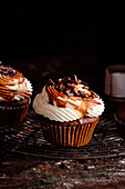 Chocolate muffins with whipped cream and caramel