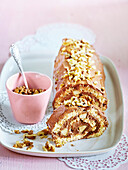Sponge roll with walnuts and pear