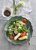 Salad with goat cheese and quail eggs