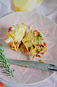 Hearty muffin with tomatoes, pine nuts, and rosemary
