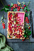 Raspberry pie with berries and cookies