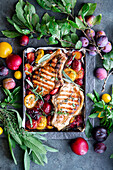 Grilled pork chops with roasted plums