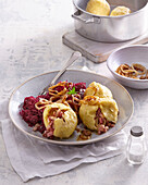 Filled potato dumplings with bacon and red cabbage