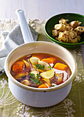 Baked broth with pancake rolls