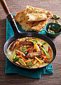 Green beef curry with naan bread