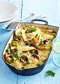 Baked potatoes with sausage and mushrooms