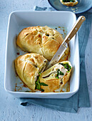 Chicken filet with spinach and cheese in puff pastry