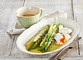 In butter poched asparagus with poched egg