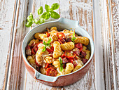 Gnocchi with tomatoes and sausage
