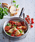 Roast halibut with tomatoes and basil