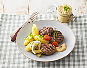 Pork burgers (patties) with boiled potatoes