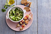 Chicken skewers with cucumber salad Asia style