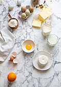 Baking ingredients: eggs, butter ricotta, flour, milk