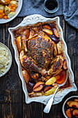 Oven-baked chicken with plums and apples