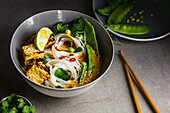 Tofu Laksa with Green beens and rice noodles, coriander herbs, lime and chili