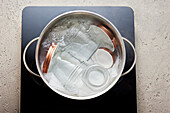 Sterilizing mason jars in boiling water