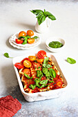 Lasagna with tomato, ricotta, and basil pesto
