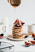 Gluten-free pancakes with figs and maple syrup