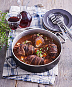 Braised beef rolls with red wine and root vegetables