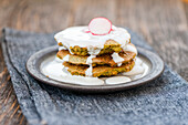 Vegetarian spinach and chickpea pancakes with yogurt