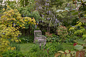 Nostalgic wicker armchair in the garden