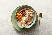 Crispy millet bowl with apricots, crispbread crumbs and chia seeds