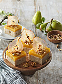 Sweet cake bars with walnuts and pear cream