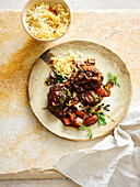 Braised beef cheeks with dates and saffron rice