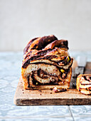 Chocolate-nut babka with pistachios and pine nuts