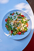 Quinoa salad with rocket, avocado and Parmesan cheese