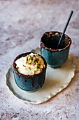 Chocolate mug cake with pistachio halawa and cream
