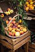 Peaches in a basket at a farmers' market