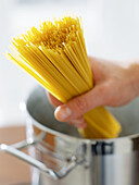 Placing Spaghetti into a Pan