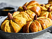 Pumpkin rolls with pecans as the stem