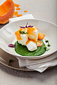 Souffled egg on creamed spinach with melted mimolette