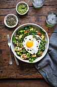 Potato broccoli artichoke warm salad with egg
